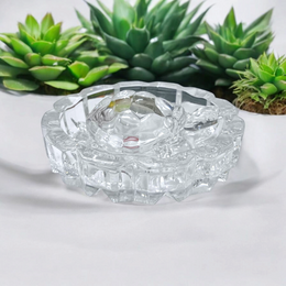 Clear crystal tortoise on round crystal plate, symbolizing Feng Shui stability and prosperity