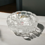 Clear crystal tortoise on round crystal plate, symbolizing Feng Shui stability and prosperity