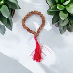 Close-up image of 7 Mukhi Rudraksha Mala 8MM beads showing natural texture and polished finish