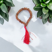 Close-up image of 7 Mukhi Rudraksha Mala 8MM beads showing natural texture and polished finish