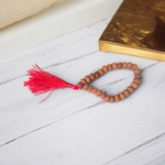 Close-up image of 7 Mukhi Rudraksha Mala 8MM beads showing natural texture and polished finish