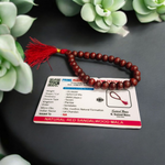 Close-up image of Lal Chandan Mala with natural red sandalwood beads in 108+1 and 27+1 variants, placed on a spiritual altar setting