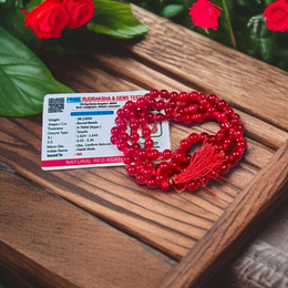 Close-up image of Natural Red Agate Mala with 108+1 polished red beads, used for Jaap and daily wear, handcrafted and lab-certified