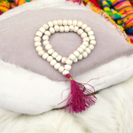 Close-up image of Natural Tulsi Mala with 54+1 smooth 8mm beads, neatly handcrafted and tied with a traditional knot