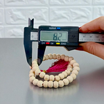 Close-up image of Natural Tulsi Mala with 54+1 smooth 8mm beads, neatly handcrafted and tied with a traditional knot