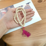 Close-up image of Natural Tulsi Mala with 54+1 smooth 8mm beads, neatly handcrafted and tied with a traditional knot