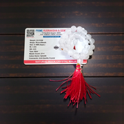 Close-up image of a premium 108+1 bead Sphatik (Crystal) Mala with 8MM beads, hand-knotted, radiant clear quartz beads, laid out on a white background