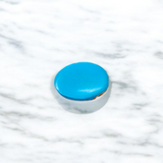 Close-up image of an Original Turquoise (Firoza) Stone with smooth polish and natural color patterns, ideal for healing and confidence