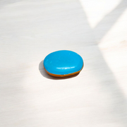 Close-up image of an Original Turquoise (Firoza) Stone with smooth polish and natural color patterns, ideal for healing and confidence