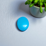 Close-up image of an Original Turquoise (Firoza) Stone with smooth polish and natural color patterns, ideal for healing and confidence