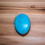 Close-up image of an Original Turquoise (Firoza) Stone with smooth polish and natural color patterns, ideal for healing and confidence