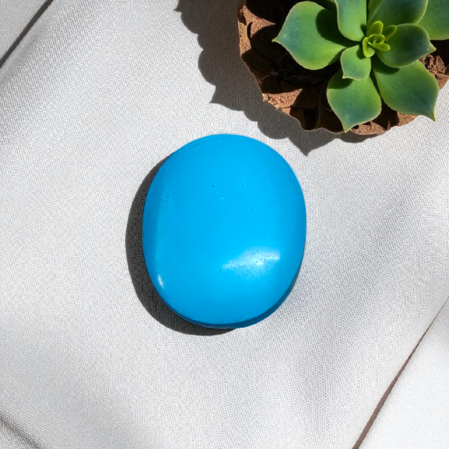 Close-up image of an Original Turquoise (Firoza) Stone with smooth polish and natural color patterns, ideal for healing and confidence