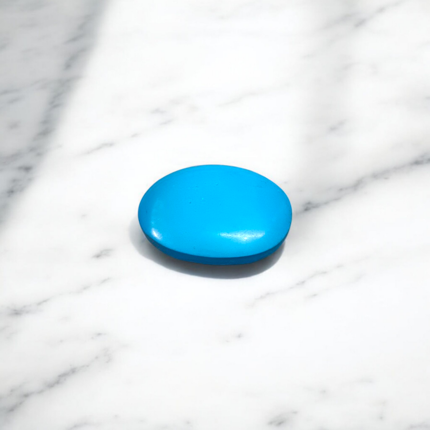 Close-up image of an Original Turquoise (Firoza) Stone with smooth polish and natural color patterns, ideal for healing and confidence