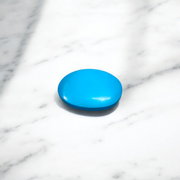 Close-up image of an Original Turquoise (Firoza) Stone with smooth polish and natural color patterns, ideal for healing and confidence