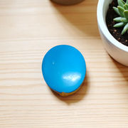 Close-up image of an Original Turquoise (Firoza) Stone with smooth polish and natural color patterns, ideal for healing and confidence