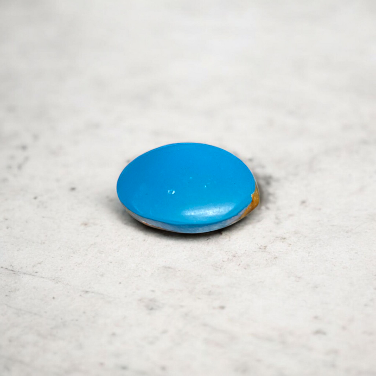 Close-up image of an Original Turquoise (Firoza) Stone with smooth polish and natural color patterns, ideal for healing and confidence