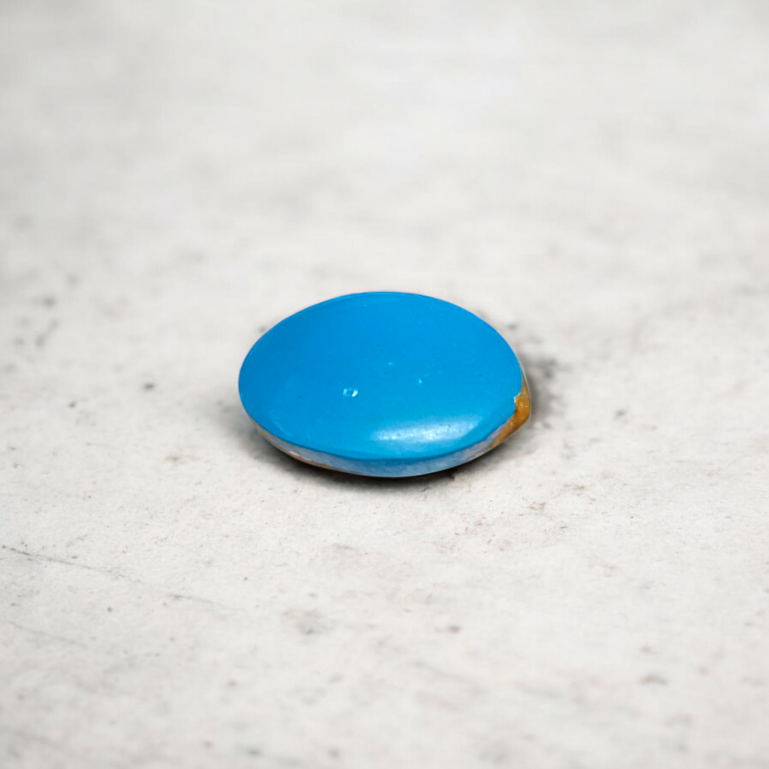 Close-up image of an Original Turquoise (Firoza) Stone with smooth polish and natural color patterns, ideal for healing and confidence
