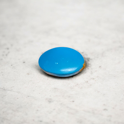 Close-up image of an Original Turquoise (Firoza) Stone with smooth polish and natural color patterns, ideal for healing and confidence