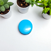 Close-up image of an Original Turquoise (Firoza) Stone with smooth polish and natural color patterns, ideal for healing and confidence