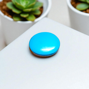 Close-up image of an Original Turquoise (Firoza) Stone with smooth polish and natural color patterns, ideal for healing and confidence