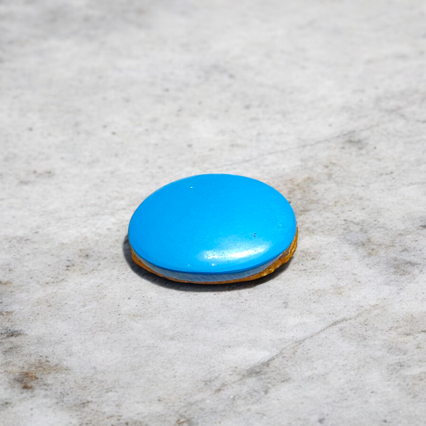 Close-up image of an Original Turquoise (Firoza) Stone with smooth polish and natural color patterns, ideal for healing and confidence