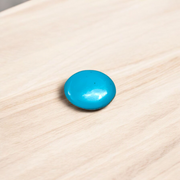 Close-up image of an Original Turquoise (Firoza) Stone with smooth polish and natural color patterns, ideal for healing and confidence