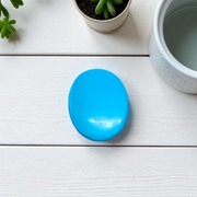 Close-up image of an Original Turquoise (Firoza) Stone with smooth polish and natural color patterns, ideal for healing and confidence