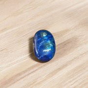 Close-up image of polished Lapis Lazuli stone by MALAWALA showing deep blue color and natural gold flecks