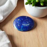 Close-up image of polished Lapis Lazuli stone by MALAWALA showing deep blue color and natural gold flecks
