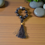 Close-up of MALAWALA Natural Black Sulemani Finger Mala with 9+1 polished 8mm beads, ideal for meditation, chanting, and daily wear