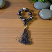 Close-up of MALAWALA Natural Black Sulemani Finger Mala with 9+1 polished 8mm beads, ideal for meditation, chanting, and daily wear