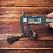 Close-up of MALAWALA Natural Black Sulemani Finger Mala with 9+1 polished 8mm beads, ideal for meditation, chanting, and daily wear