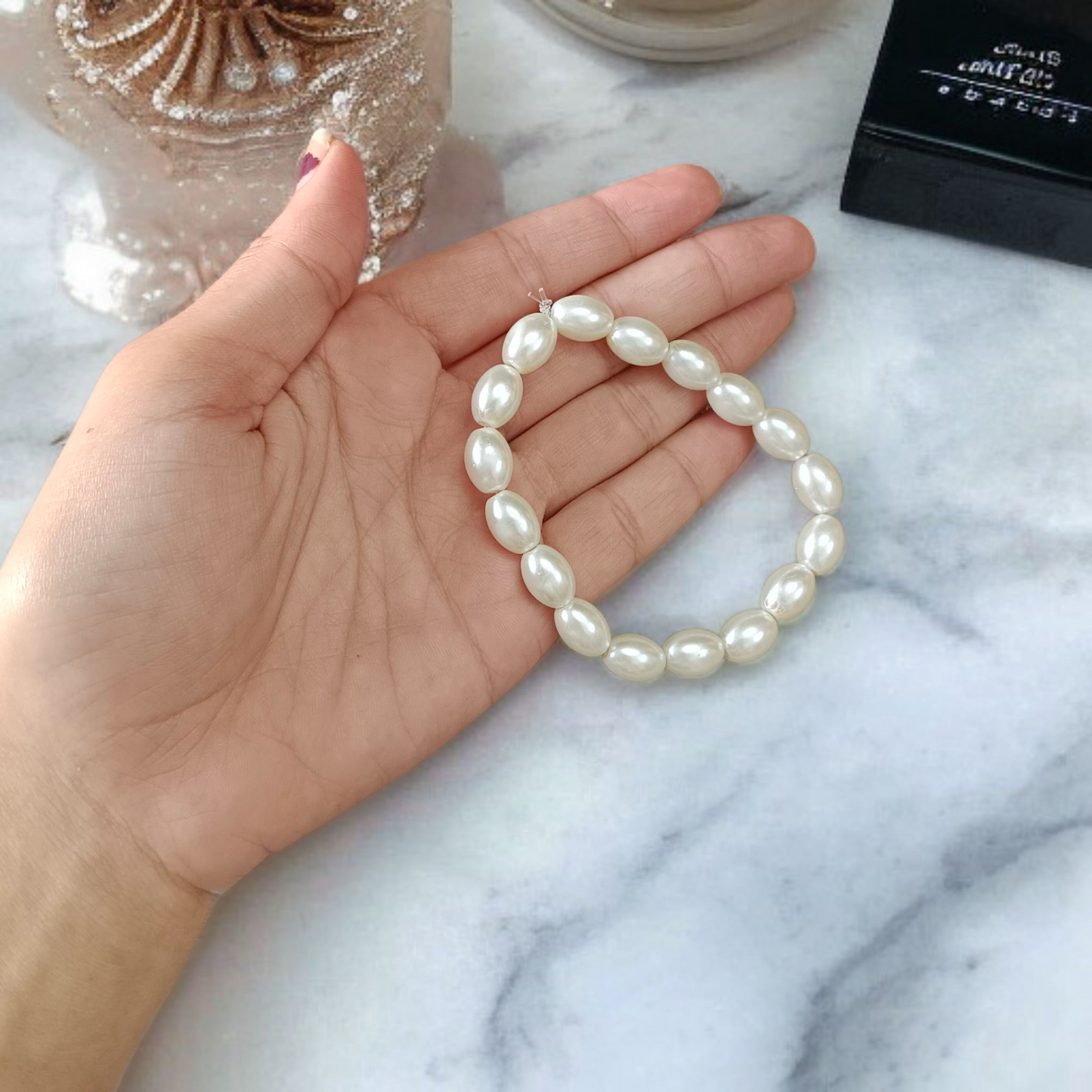 Close-up of MALAWALA Natural Pearl Bracelet featuring 10–11mm round white pearls on elastic thread, ideal for daily wear, meditation, and gifting