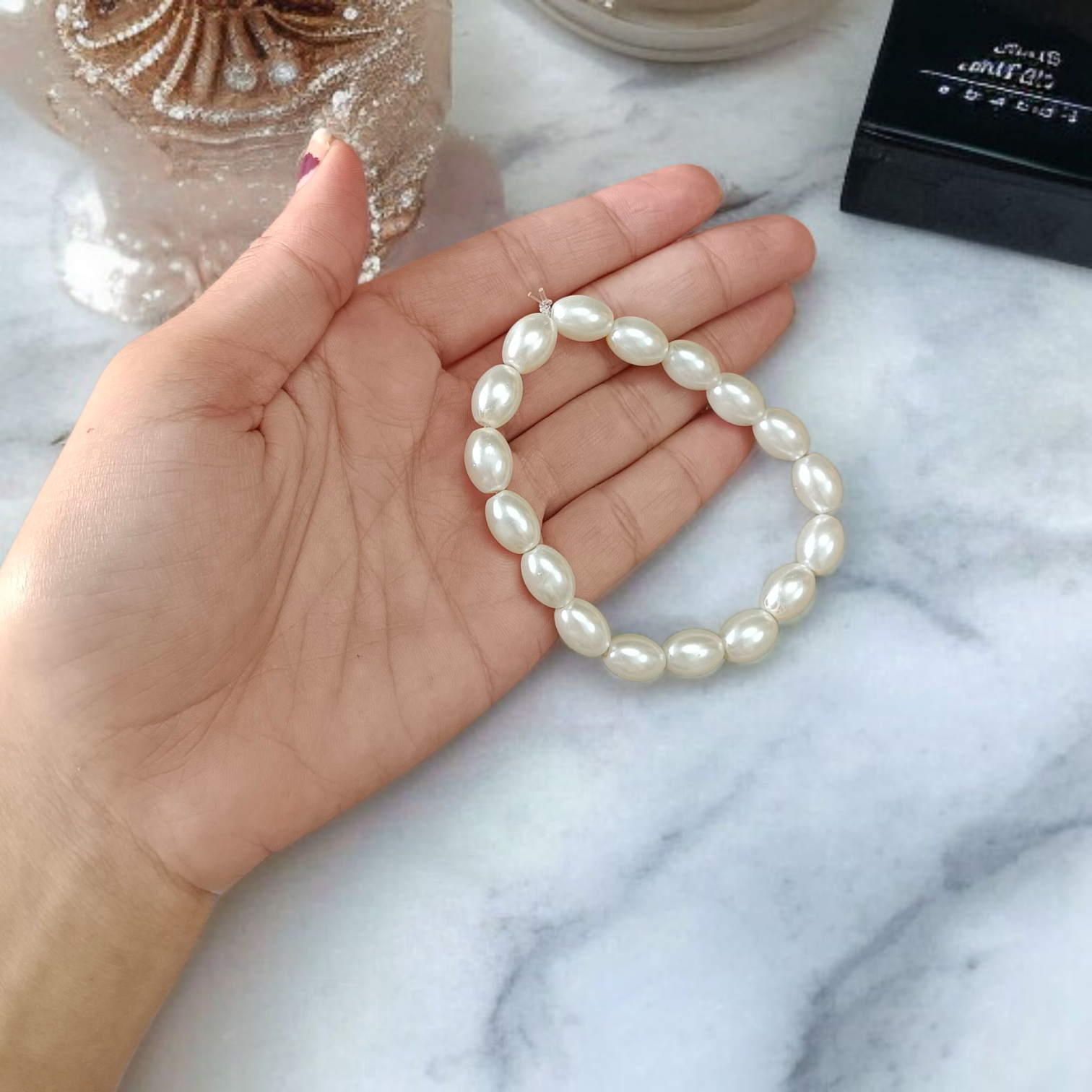 Close-up of MALAWALA Natural Pearl Bracelet featuring 10–11mm round white pearls on elastic thread, ideal for daily wear, meditation, and gifting