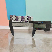 Close-up of Natural Amethyst and White Agate bracelet with polished beads for meditation and healing