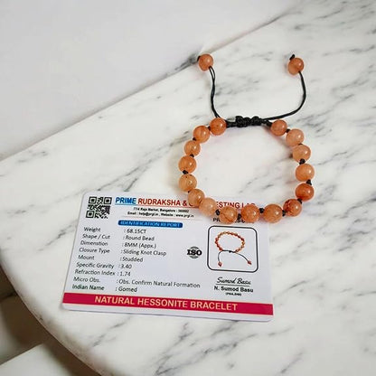 Close-up of Natural Gomed (Hessonite) 8MM bracelet with polished beads on elastic string
