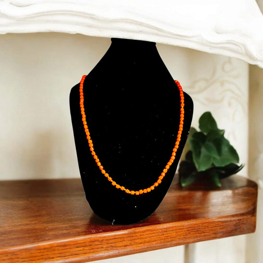 Close-up of Orange Monga Mala with 108+1 natural coral beads, traditionally hand-knotted for spiritual and astrological use