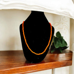 Close-up of Orange Monga Mala with 108+1 natural coral beads, traditionally hand-knotted for spiritual and astrological use