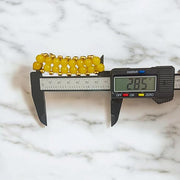 Close-up of Yellow Hakik Agate Bracelet with 8MM polished natural beads arranged in a circular pattern on a neutral background