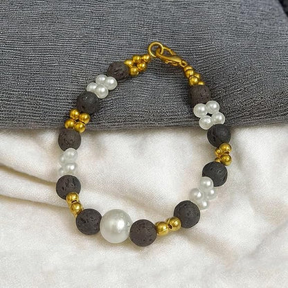 Close-up of a handcrafted lava bracelet featuring genuine lab-certified black lava beads on an elastic cord