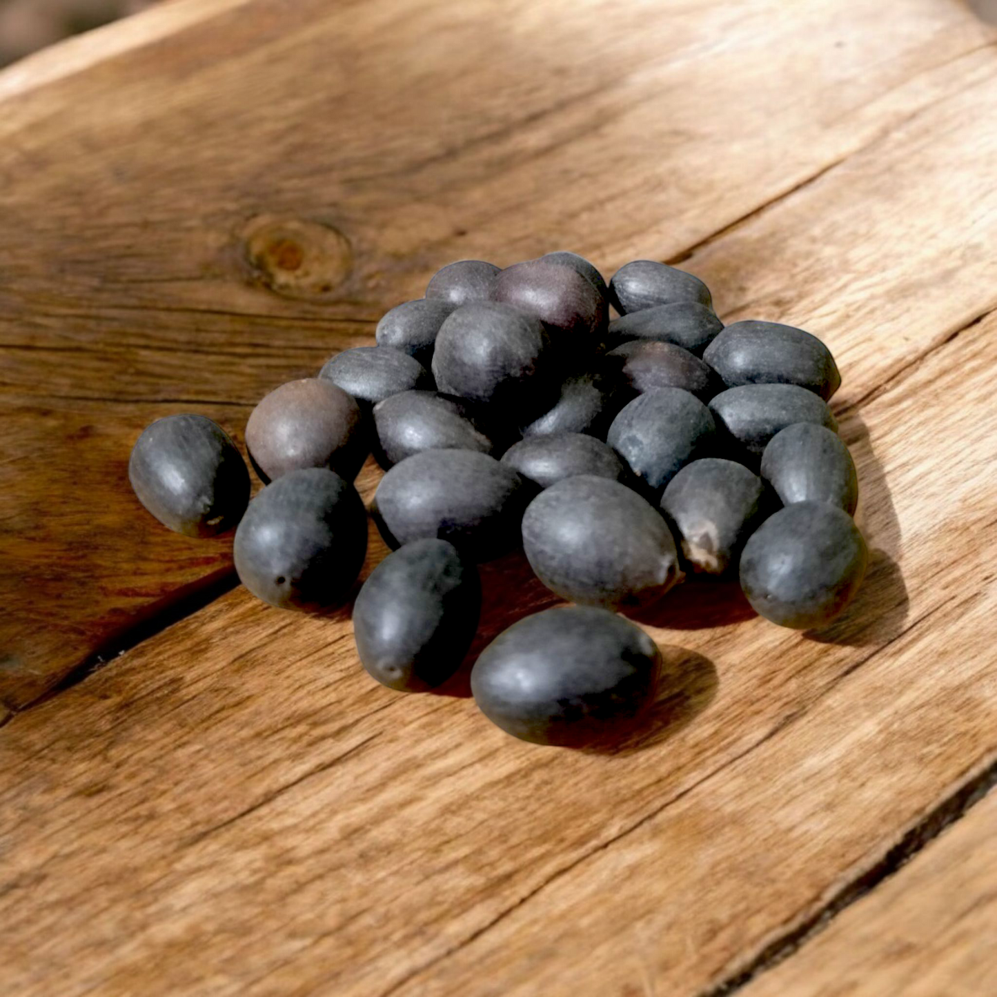Close-up of natural Kamal Gutta (lotus seeds), lab-certified, displayed on a white background with subtle spiritual elements