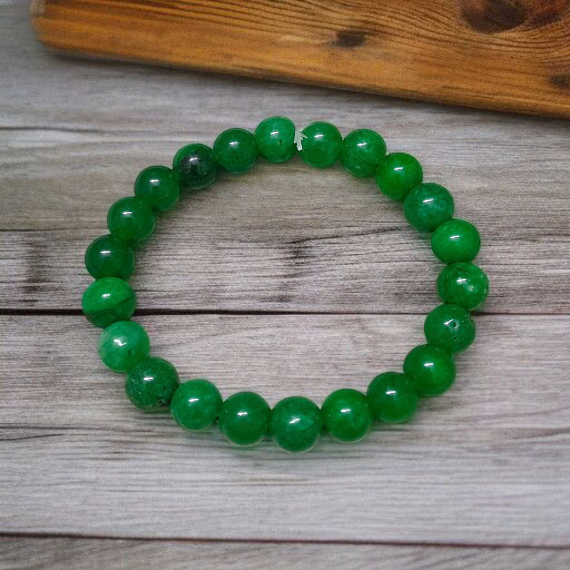 Close-up of stretchable Green Onyx Bracelet with 8mm polished beads, designed by MALAWALA