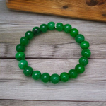 Close-up of stretchable Green Onyx Bracelet with 8mm polished beads, designed by MALAWALA