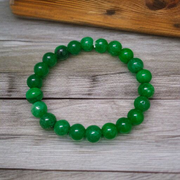 Close-up of stretchable Green Onyx Bracelet with 8mm polished beads, designed by MALAWALA
