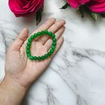 Close-up of stretchable Green Onyx Bracelet with 8mm polished beads, designed by MALAWALA