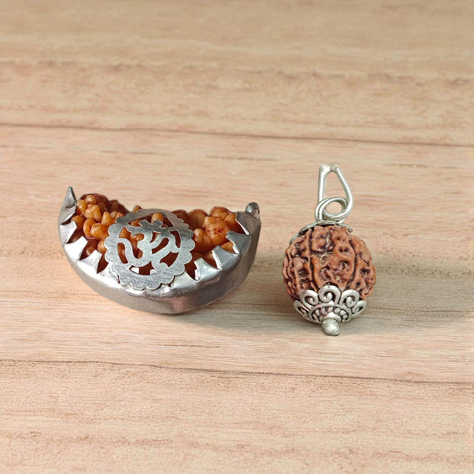 Combo Rudraksha pendant featuring lab certified 1 Mukhi and 6 Mukhi beads set in metal caps, ideal for spiritual and energy healing purposes