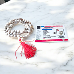 Combo set of Crystal (Sphatik) Mala and Vaijanti Mala placed on a sacred cloth, highlighting their beads and craftsmanship