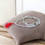 Combo set of Crystal (Sphatik) Mala and Vaijanti Mala placed on a sacred cloth, highlighting their beads and craftsmanship