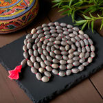 Combo set of Kamal Gutta Mala and Rudraksha Mala with 108+1 beads each, used for mantra chanting, meditation, and spiritual rituals