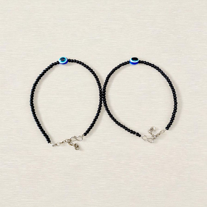 Elegant anklet with blue evil eye charm for girls and women, featuring adjustable chain and delicate bead detailing, designed for protection and style